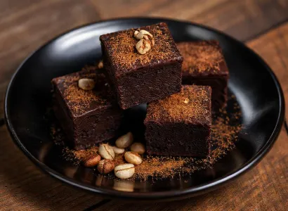 Carrés fondants au chocolat noir, cannelle et noisettes